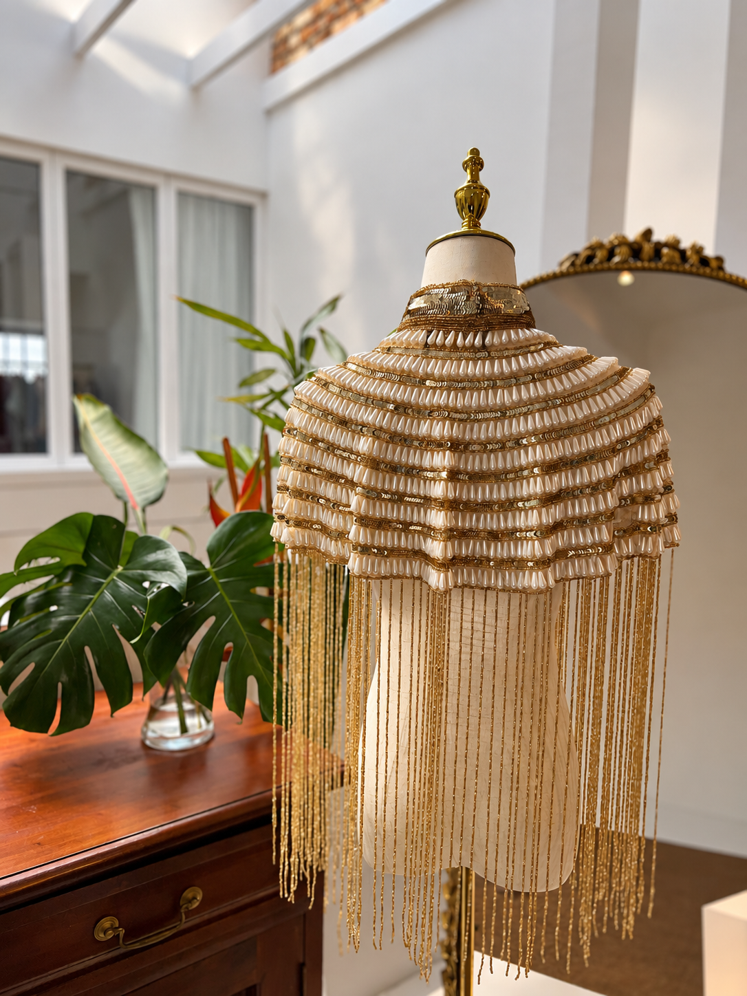 An elegant handmade Pearl beaded cape with delicate detailing and flowing fringe, perfect for bridal looks, weddings, dinner outfits and sophisticated evenings.