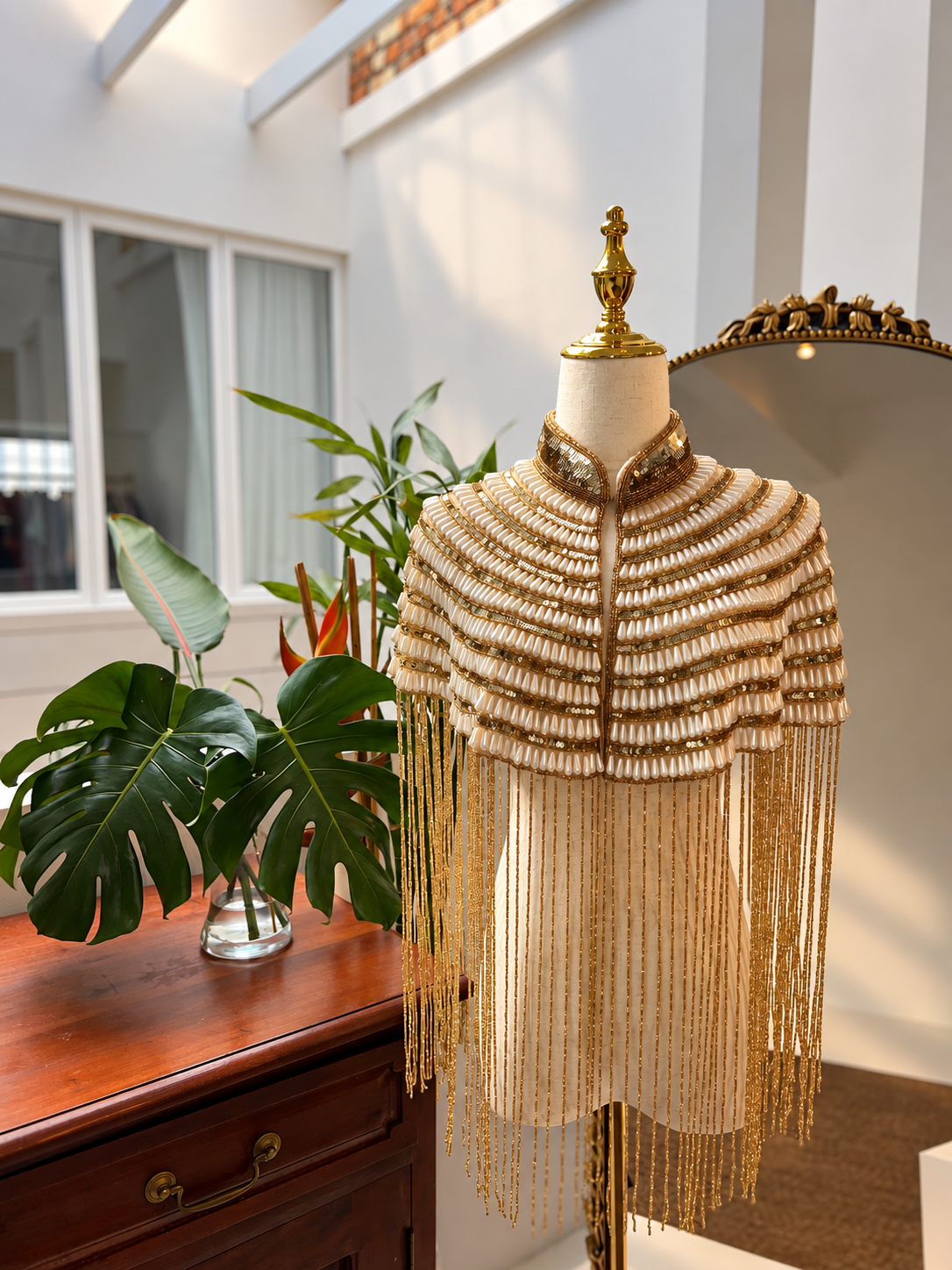 An elegant handmade Pearl beaded cape with delicate detailing and flowing fringe, perfect for bridal looks, weddings, dinner outfits and sophisticated evenings.