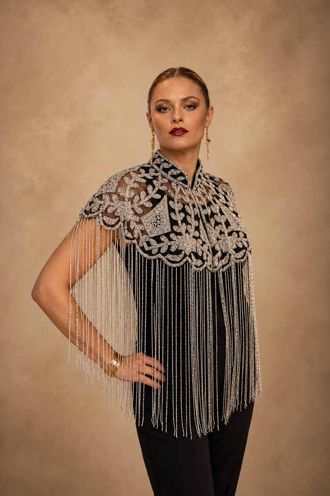 Silver sequin handmade beaded fringe cape styled as a luxury statement accessory for festival, dinner and evening outfits by Raja Ran